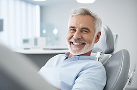 Smiling older man in dental treatment chair